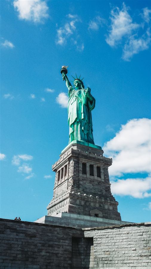 Statue of Liberty against a blue sky, New York